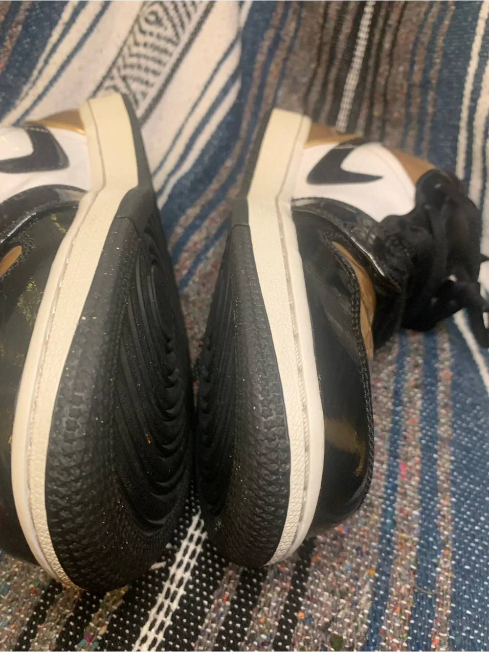 Air Jordan low “Gold Toe” in size 11 men.
